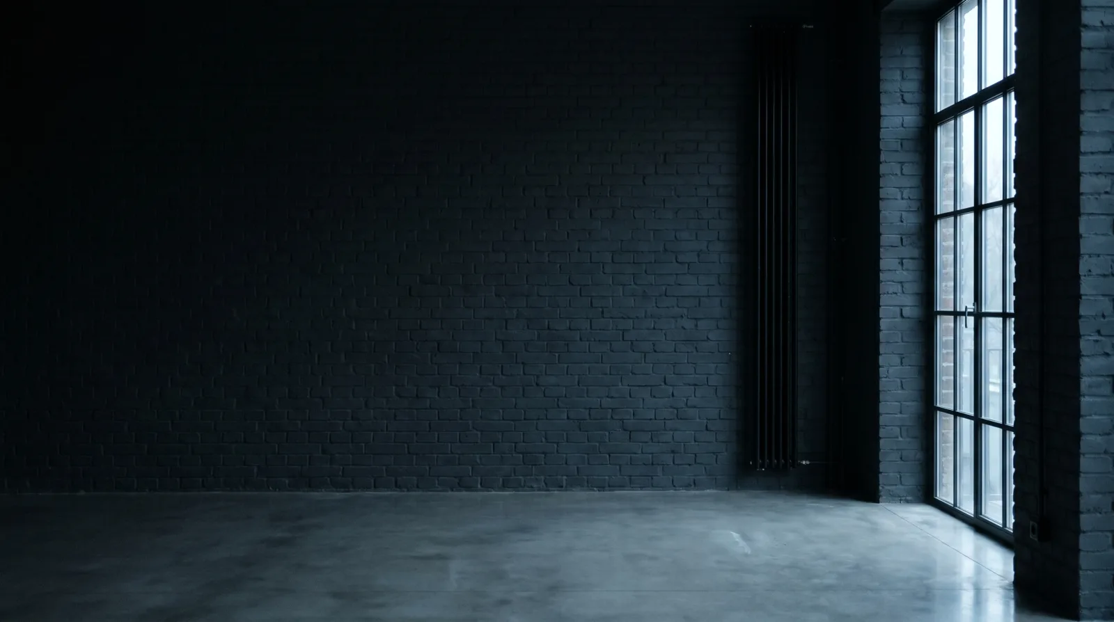 Tall steel-frame warehouse window with diffuse daylight in a quiet Berlin industrial interior, dark anthracite brick walls, polished concrete floor.